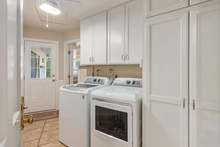 Ample Cabinets for Linens. Door goes out to pool area.  Large closet across from washer/dryer.