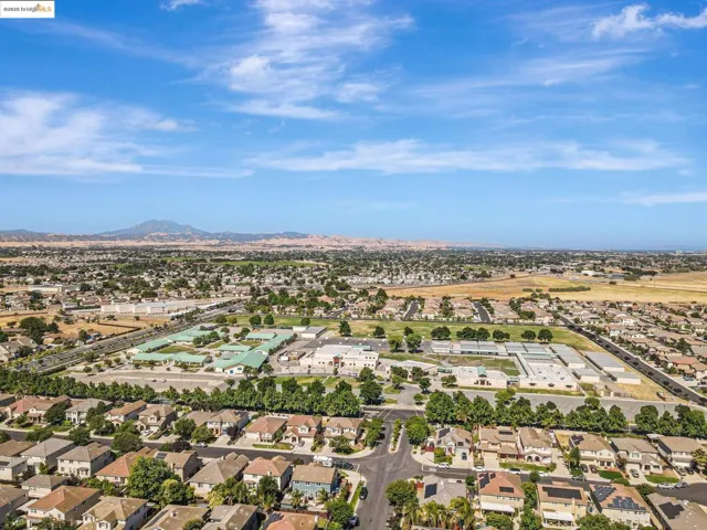 View of property location featuring nearby suburban area and a mountainous background