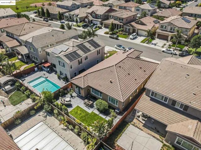 Aerial perspective of suburban area with a pool area