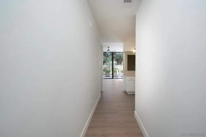 EN SUITE HALLWAY VIEW TO MBA- VIEW OF FLOOR TO CEILING GLASS