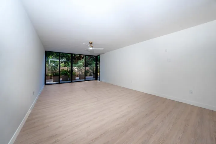 ENOURMOUS LR FLOOR TO CEILING GLASS