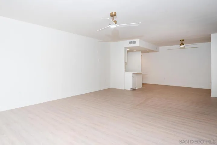 VIEW TO KITCHEN FROM FLOOR TO CEILING GLASS WALL
