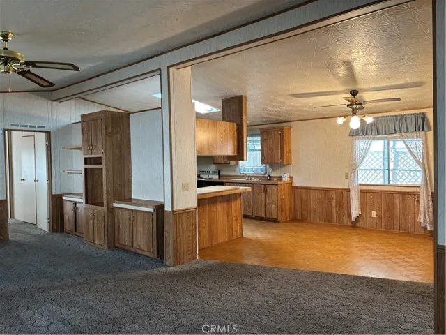 Living room, with nice built-ins, looking toward dining area and kitchen
