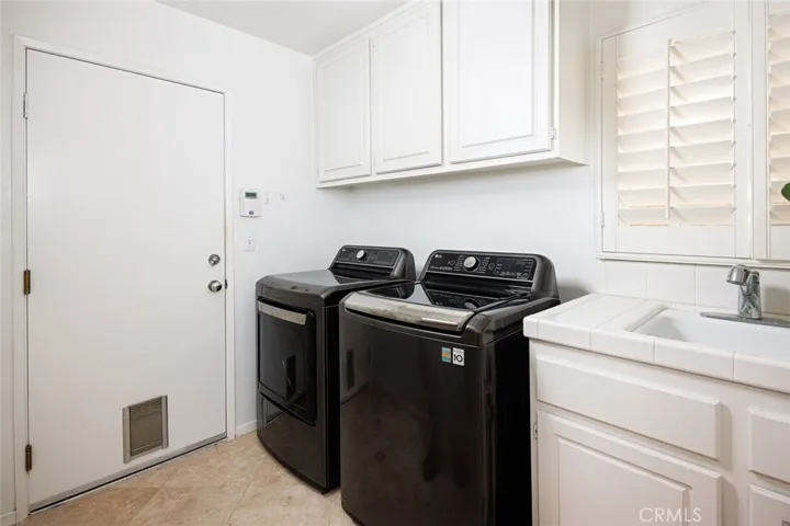 Downstairs/Inside Laundry Room with sink.