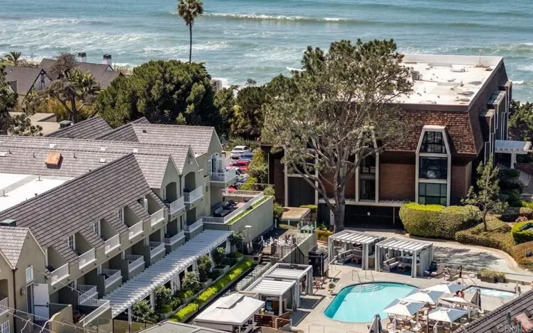 Residents enjoy access to all hotel amenities including heated pool, jacuzzi, fitness center, tennis