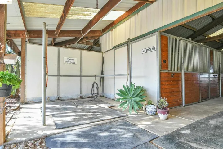 Garage featuring metal wall