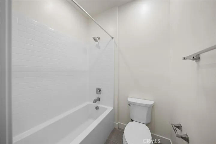 Hallway Bath with separate tub/shower and toilet.