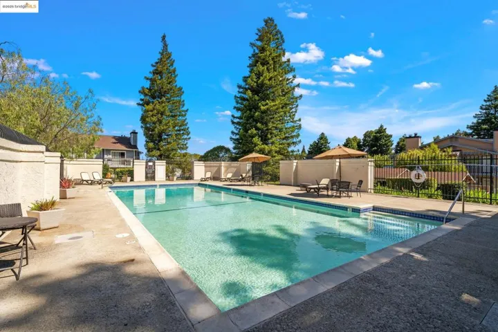 Community pool featuring a patio area