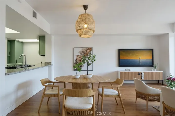 VIRTUAL STAGED PHOTOS.
Kitchen pass through opening from kitchen into dining area and Livingroom.