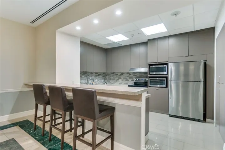 Condo community bar and full kitchen.