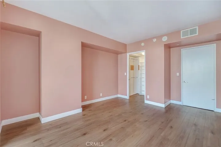 Another view of Primary bedroom view of walk-in closet and entry.