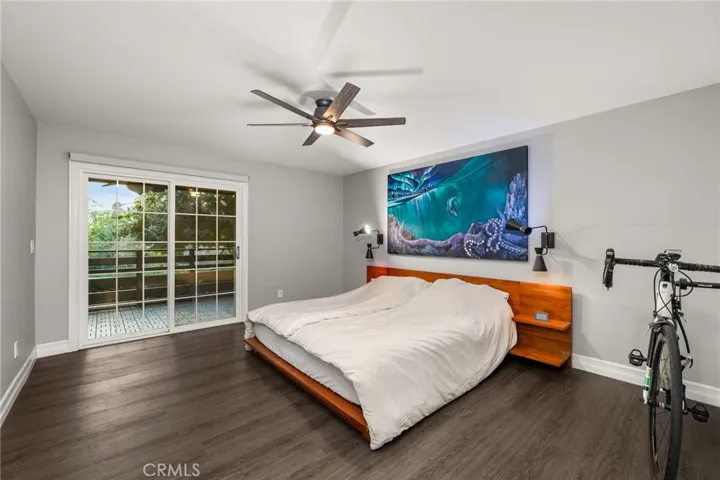 Primary bedroom with a view of the lake