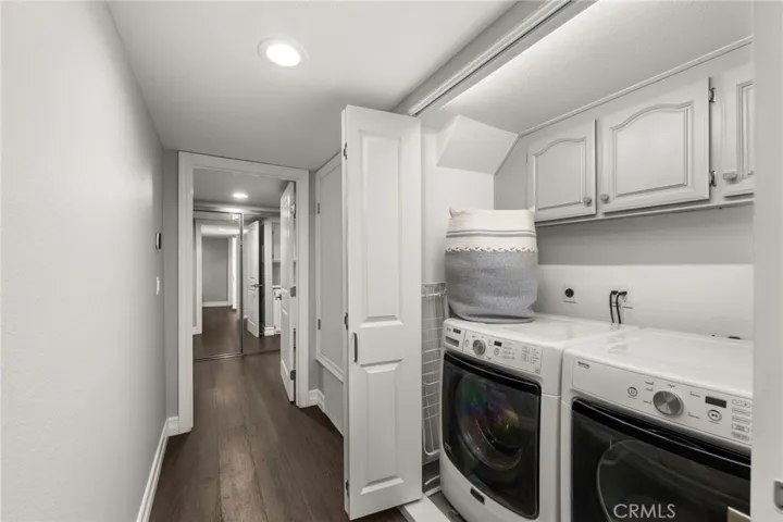 Indoor laundry space with storage.