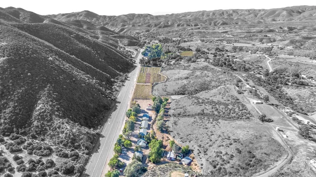Lots of highway frontage  Motel and land planted in grapes