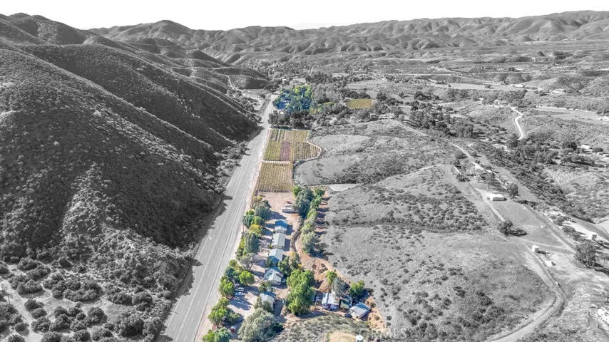 Lots of highway frontage  Motel and land planted in grapes
