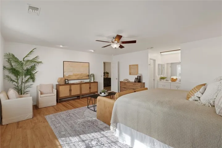 Spacious primary bedroom with room for multiple sitting areas