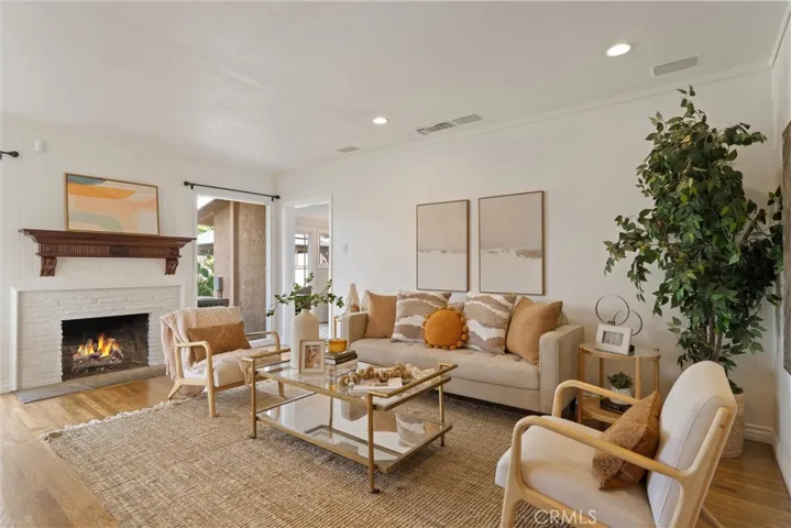 Living area with fireplace and access to 4th bedroom/bonus room