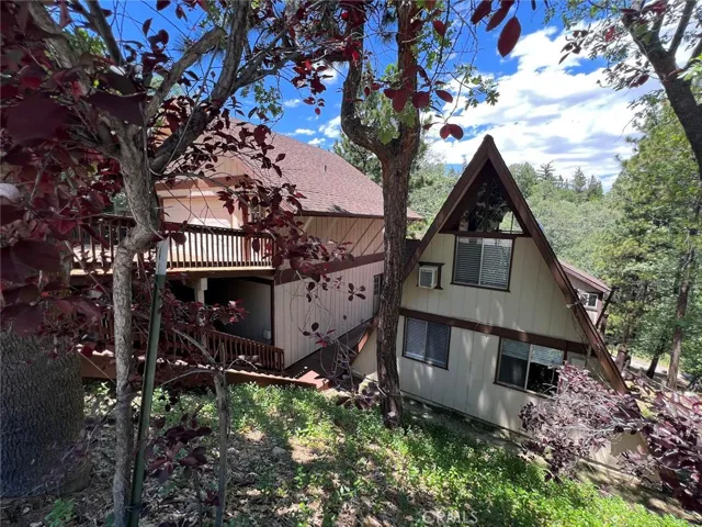 The studio unit is below the garage. The A-frame is the main unit. Another 1BR apt below.