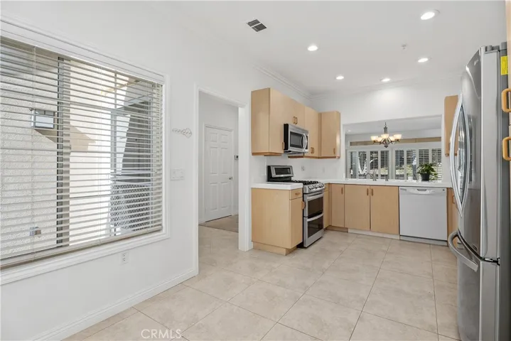 The spacious kitchen provides ample room for a dining table and chairs, creating the perfect spot for casual meals or morning coffee.