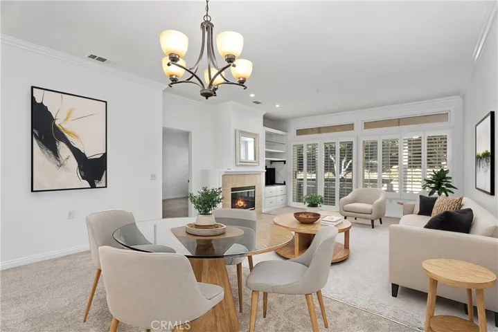 This inviting and cozy living room provides a warm, welcoming atmosphere—ideal for both everyday relaxation and effortless entertaining.  (Virtually staged)