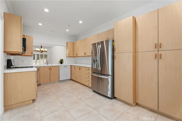 The kitchen features an impressive amount of cabinetry, ensuring ample storage and effortless organization.