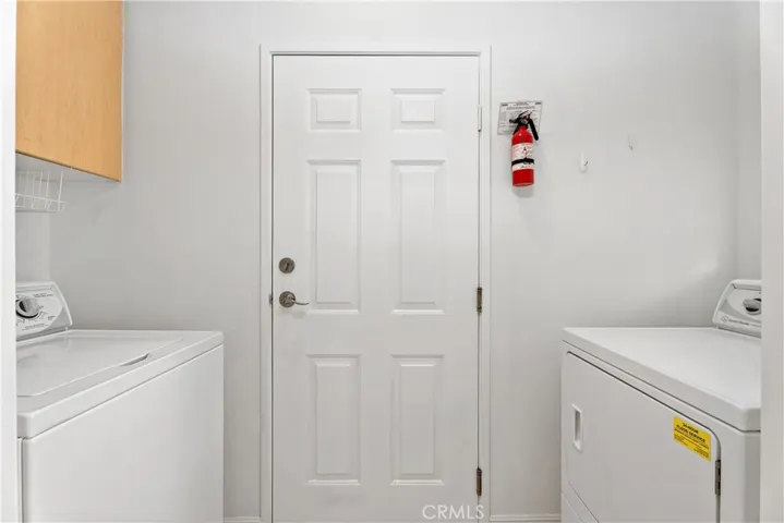 The laundry area just off the kitchen makes this chore effortless.