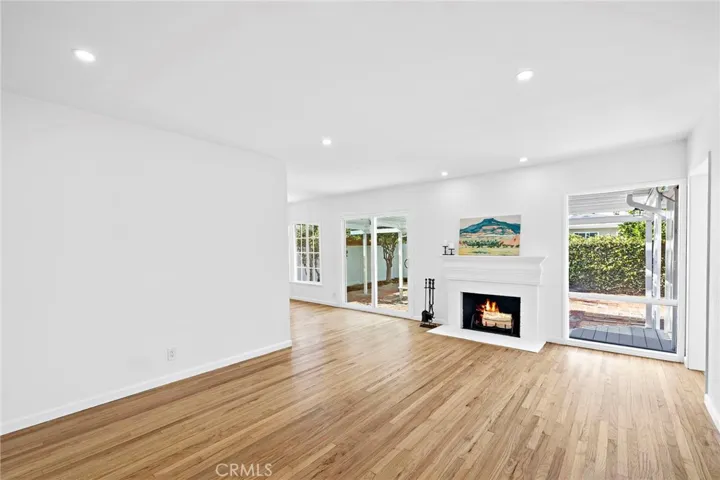 Open living room with charming fireplace