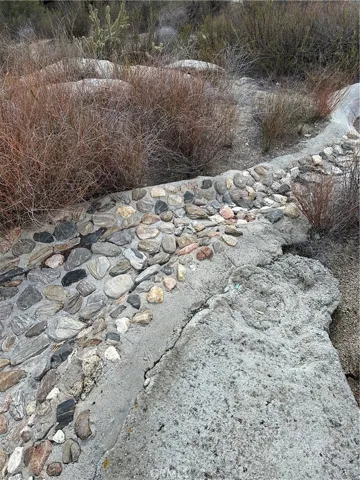 Rock around pool.