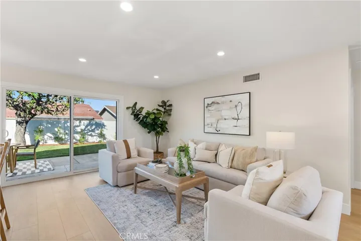 Throughout this home, you'll see plenty of natural light as you do in this family room off the kitchen.