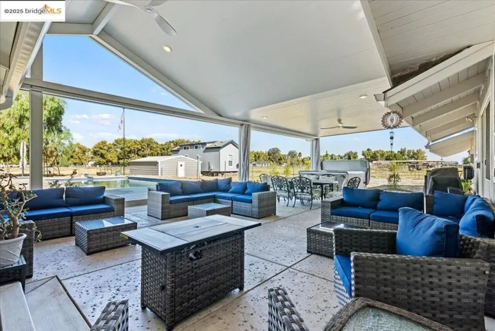 View of patio / terrace featuring outdoor lounge area, outdoor dining space, and ceiling fan