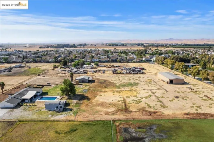 Aerial view of residential area with a mountainous background