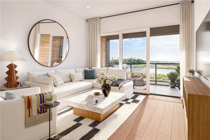 Living Room and Deck - Images shown are artist renderings and not actual unit. Final finishes may vary.