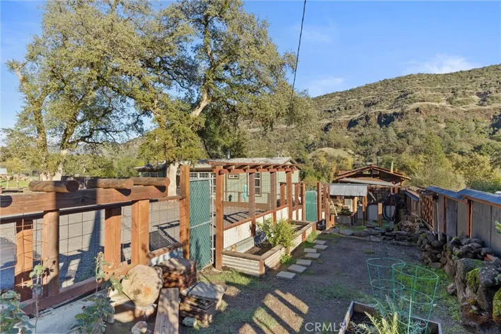 Very Nice Garden area Completed with Water and Deer Protection Fencing.  Could Also Function as a Dog Run Area.
