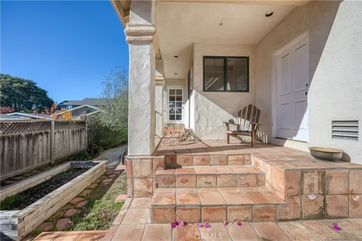 Door from kitchen to one of the patios.