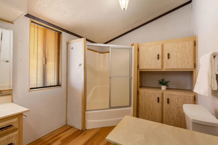 Primary bathroom with shower over tub