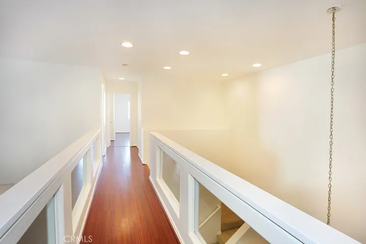 Catwalk separates primary suite from guest bedrooms