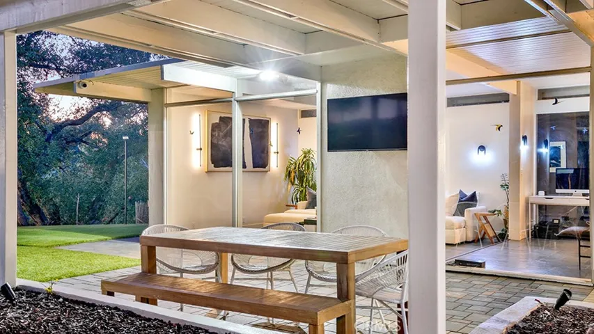 Covered Patio Area. Notice the beautiful Trees on the left.