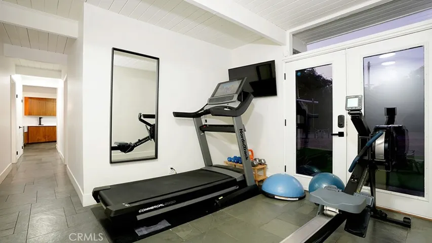 Workout area. Doors exit to Front Yard.