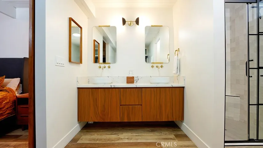 Dual Sinks and Cabinet in Master Bathroom. Walk in Shower is to the right.