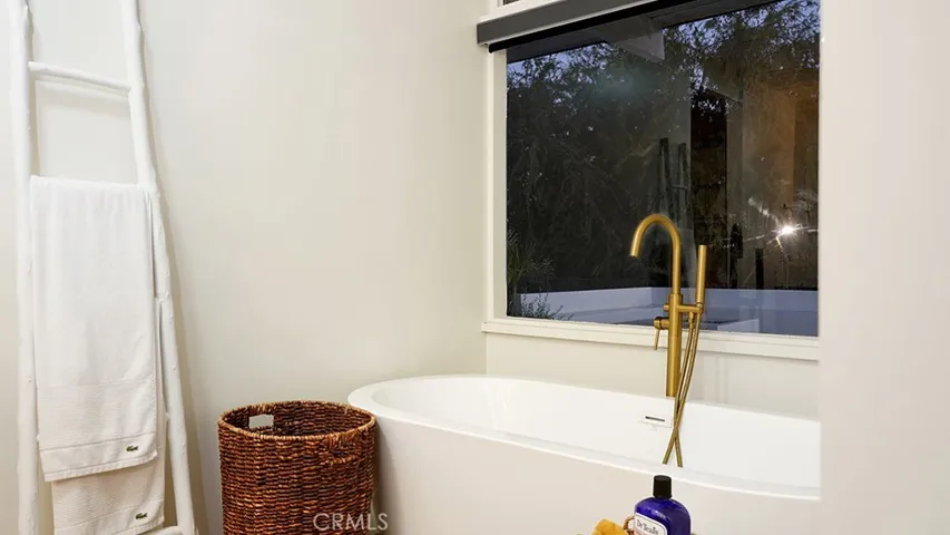 Tub with window to Backyard.