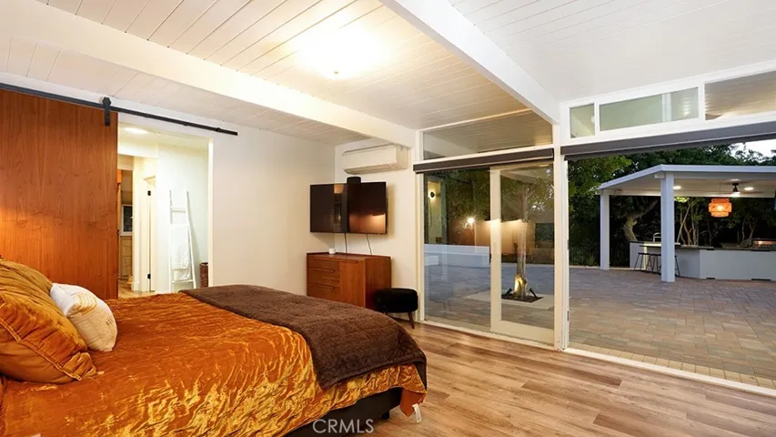 Master Bedroom looking out to Outdoor Kitchen.