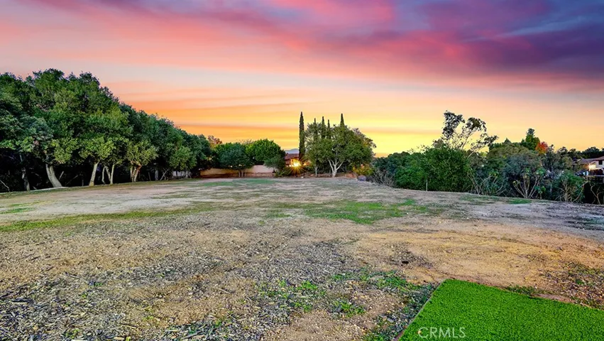 Lot Next Door which we also have For Sale.  MLS #CV25264739 Owners may negotiate a bit if both properties sold together. Unlimited ways to expand, build - the sky's the limit on the possibilities you would have..
End of Twilight Shots.....