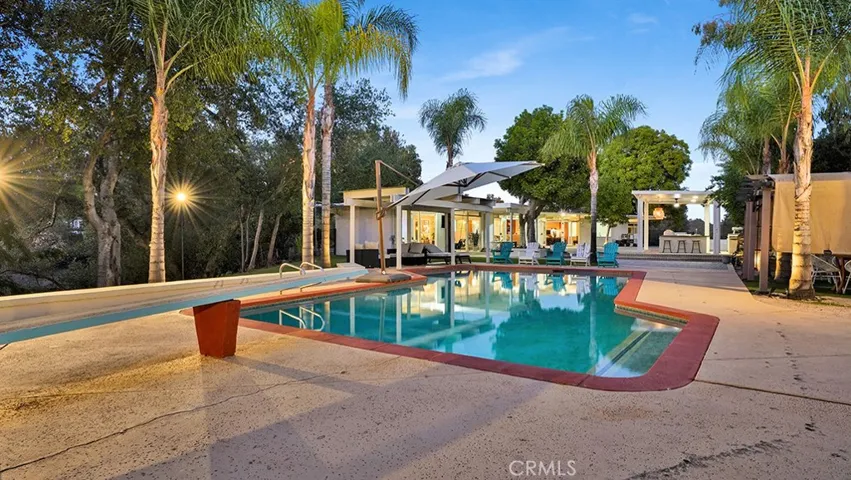 Back of Pool area looking towards the House (to the left). Cabana Seating under Cover (to the right).