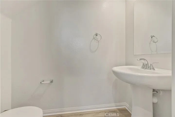 Half bathroom downstairs next to bonus room.