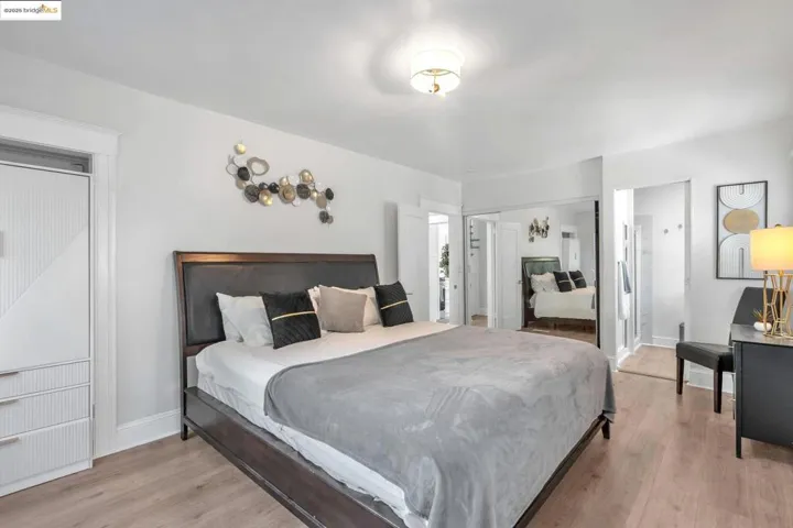 Bedroom featuring light wood-style flooring and a closet