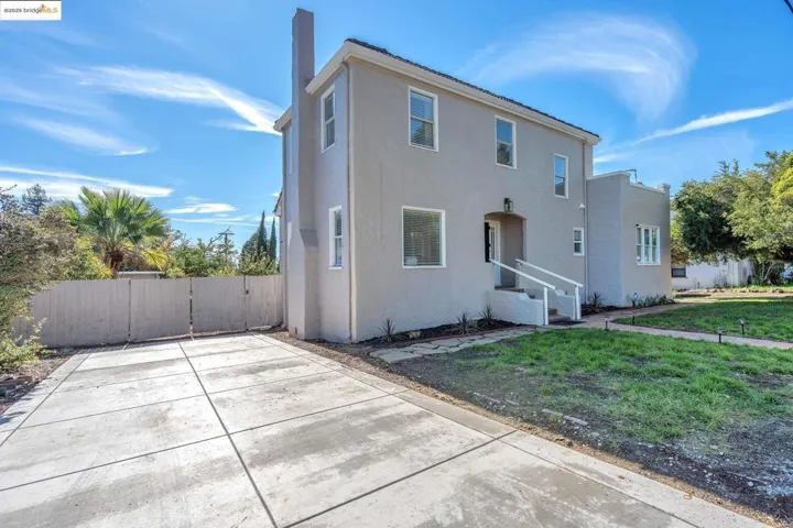 Rear view of house featuring stucco siding