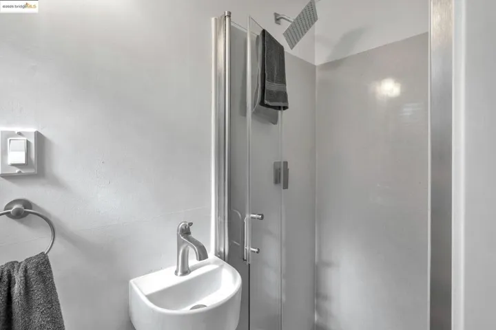 Full bathroom featuring a stall shower