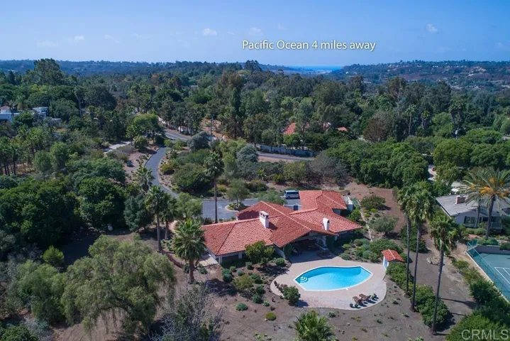 Over 3 acres of privacy and tranquility including garden boxes, a vineyard, and lush landscaping.