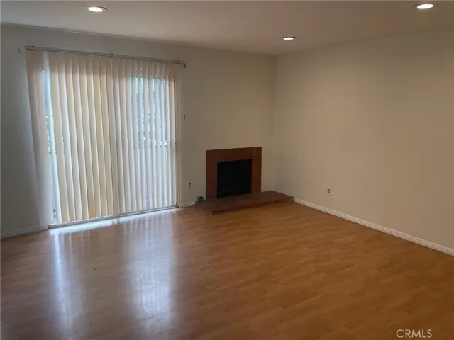 Living room with a fireplace and sliding doors to the outdoor patio