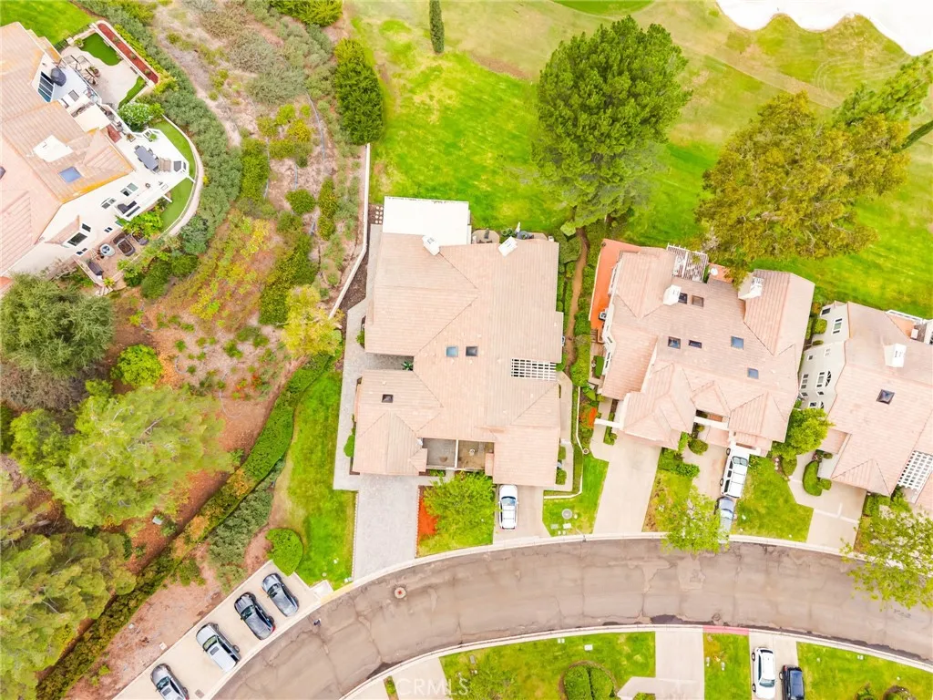 Aerial view showcasing the home's position along the 15th fairway